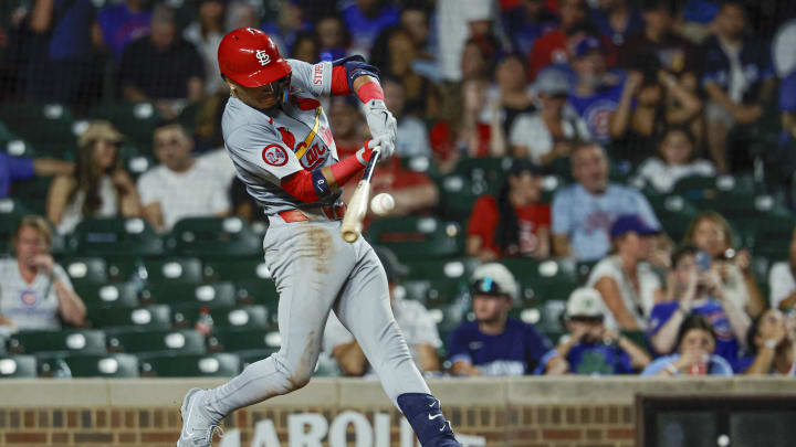 Aug 1, 2024; Chicago, Illinois, USA; St. Louis Cardinals shortstop Masyn Winn (0) hits a two-run home run against the Chicago Cubs during the seventh inning at Wrigley Field. Mandatory Credit: Kamil Krzaczynski-USA TODAY Sports