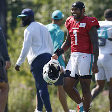 Miami Dolphins quarterback Tua Tagovailoa (1) walks on the field during joint training camp practice with the Chicago Bears ahead of the preseason opener.