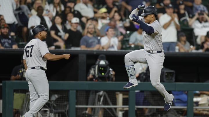 Aug 13, 2024; Chicago, Illinois, USA; New York Yankees outfielder Juan Soto (22) celebrates as he rounds the bases after hitting a solo home run against the Chicago White Sox during the seventh inning at Guaranteed Rate Field.