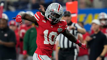 Ohio State Buckeyes cornerback Denzel Burke celebrates a tackle  against Missouri in the Cotton Bowl. 