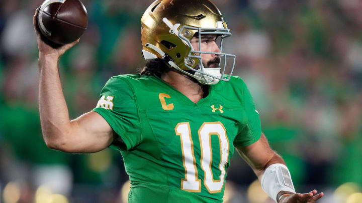 Sep 23, 2023; South Bend, Indiana, USA; Notre Dame Fighting Irish quarterback Sam Hartman (10) throws the ball against Ohio State Buckeyes during the fourth quarter of their game at Notre Dame Stadium.