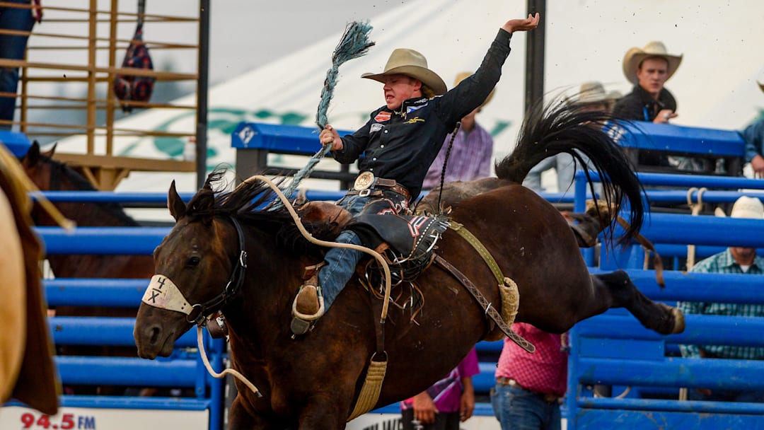 Dawson Hay makes an 84.5 point ride in the saddle bronc event during the Big Sky Pro Rodeo on Friday at the Montana State Fair.