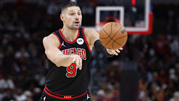Dec 6, 2024; Chicago, Illinois, USA; Chicago Bulls center Nikola Vucevic (9) passes the ball against the Indiana Pacers during the second half at United Center. Mandatory Credit: Kamil Krzaczynski-Imagn Images