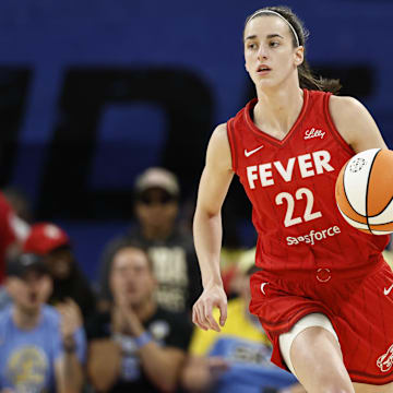 Aug 30, 2024; Chicago, Illinois, USA; Indiana Fever guard Caitlin Clark (22) brings the ball up court against the Chicago Sky during the first half at Wintrust Arena.