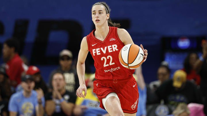 Aug 30, 2024; Chicago, Illinois, USA; Indiana Fever guard Caitlin Clark (22) brings the ball up court against the Chicago Sky during the first half at Wintrust Arena.