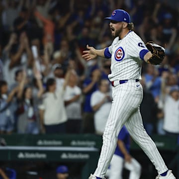 Sep 4, 2024; Chicago, Illinois, USA; Chicago Cubs relief pitcher Porter Hodge (37) celebrates teams win against the Pittsburgh Pirates in a baseball game at Wrigley Field.