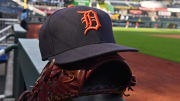 Jul 23, 2018; Kansas City, MO, USA; A general view of a Detroit Tigers cap and glove on the dugout railing, prior to a game against the Kansas City Royals at Kauffman Stadium. 