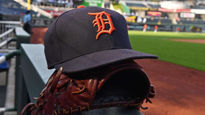 Jul 23, 2018; Kansas City, MO, USA; A general view of a Detroit Tigers cap and glove on the dugout railing, prior to a game against the Kansas City Royals at Kauffman Stadium. 