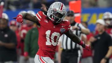 Dec 29, 2023; Arlington, TX, USA; Ohio State Buckeyes cornerback Denzel Burke (10) celebrates a