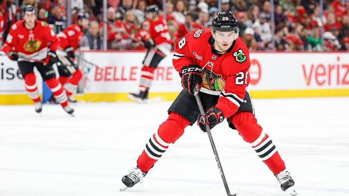 Mar 22, 2026; Chicago, Illinois, USA; Chicago Blackhawks left wing Andre Burakovsky (28) controls the puck against the Nashville Predators during the first period at United Center. Mandatory Credit: Kamil Krzaczynski-Imagn Images