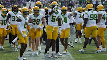 Sep 13, 2025; Evanston, Illinois, USA; Oregon Ducks linebacker Jerry Mixon (54) gestures after intercepting a pass against the Northwestern Wildcats during the second half at Northwestern Medicine Field at Martin Stadium. Mandatory Credit: David Banks-Imagn Images
