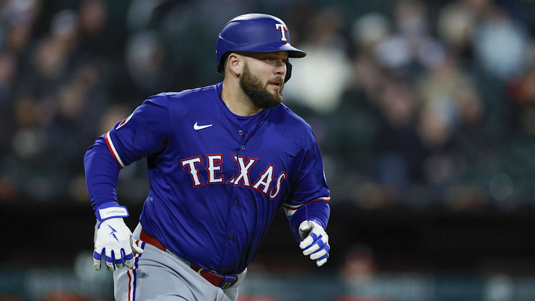 May 23, 2025; Chicago, Illinois, USA; Texas Rangers first baseman Jake Burger (21) runs after hitting an RBI-double against the Chicago White Sox during the sixth inning at Rate Field.
