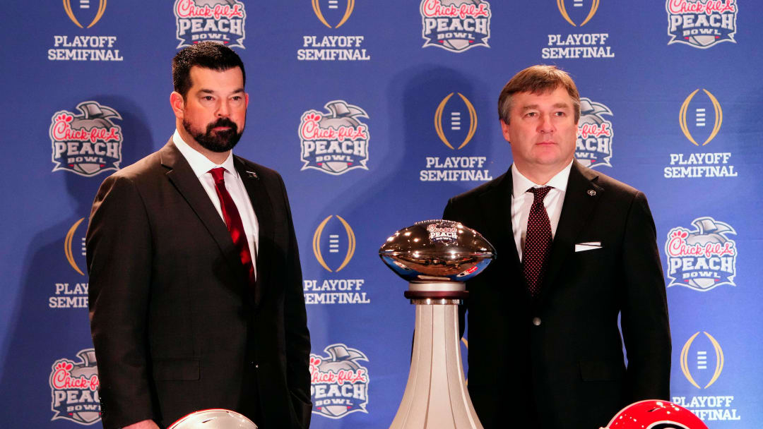 Dec 30, 2022; Atlanta, GA, USA; Ohio State Buckeyes head coach Ryan Day and Georgia Bulldogs head coach Kirby Smart pose for a photo during the coaches Peach Bowl press conference at the Westin Peachtree Plaza.

Ceb Peachbowl Coaches Kwr 08