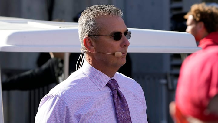 Oct 21, 2023; Columbus, Ohio, USA; Former Ohio State Buckeye football coach Urban Meyer walks to the Big Noon Kickoff show set before the Penn State Nittany Lions game at Ohio Stadium.