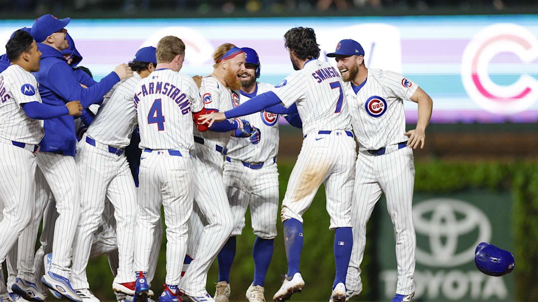 May 13, 2025; Chicago, Illinois, USA; Chicago Cubs first baseman Justin Turner (3) celebrates with teammates after hitting a walk-off two-run double against the Miami Marlins during the ninth inning at Wrigley Field. Mandatory Credit: Kamil Krzaczynski-Imagn Images