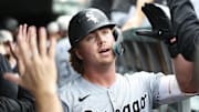 Chicago White Sox shortstop Chase Meidroth (10) celebrates with teammates after hitting his first major league home run against the Chicago Cubs at Wrigley Field. 