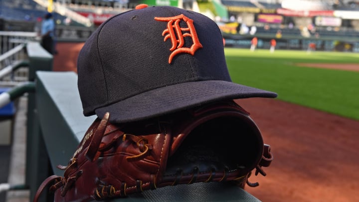 Jul 23, 2018; Kansas City, MO, USA; A general view of a Detroit Tigers cap and glove on the dugout railing, prior to a game against the Kansas City Royals at Kauffman Stadium. 