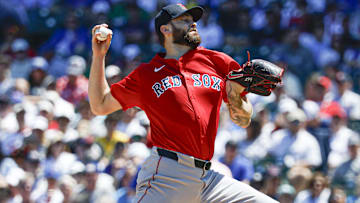 Boston Red Sox starting pitcher Lucas Giolito (54) delivers a pitch against the Chicago Cubs during the first inning at Wrigley Field.