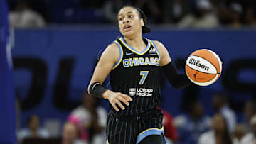 Aug 25, 2024; Chicago, Illinois, USA; Chicago Sky guard Chennedy Carter (7) brings the ball up court against the Las Vegas Aces during the first half at Wintrust Arena. Mandatory Credit: Kamil Krzaczynski-Imagn Images