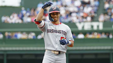 Sep 6, 2025; Chicago, Illinois, USA; Washington Nationals left fielder Daylen Lile (51) celebrates after hitting a single against the Chicago Cubs during the first inning at Wrigley Field. 