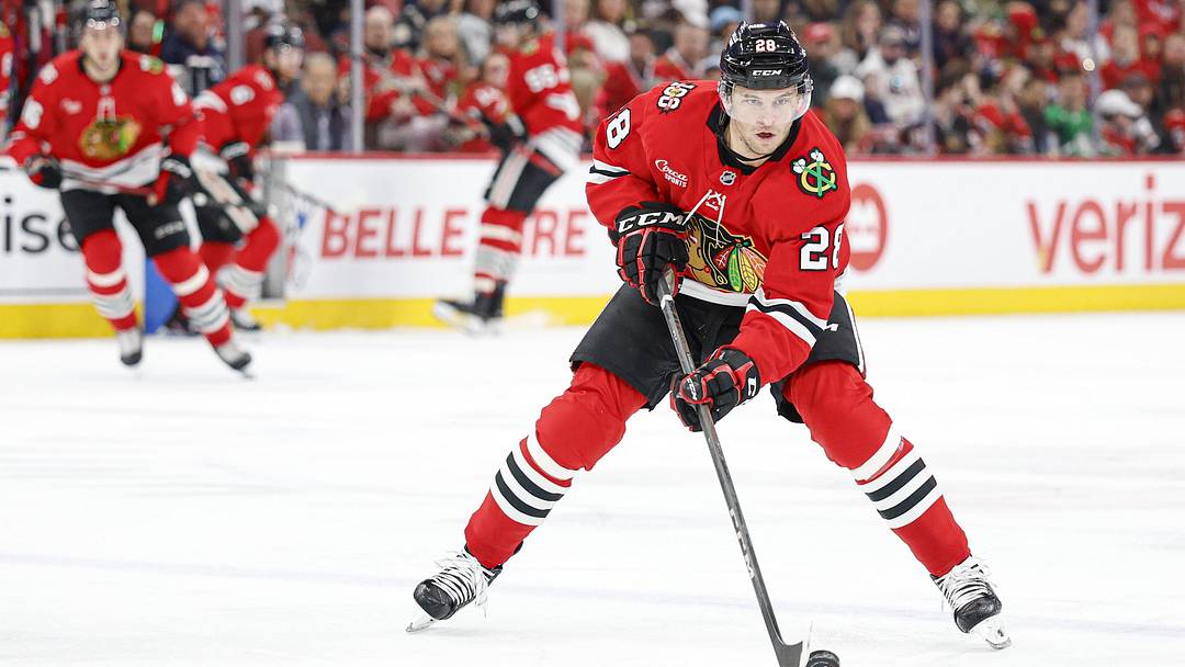 Mar 22, 2026; Chicago, Illinois, USA; Chicago Blackhawks left wing Andre Burakovsky (28) controls the puck against the Nashville Predators during the first period at United Center. Mandatory Credit: Kamil Krzaczynski-Imagn Images