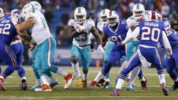 Miami Dolphins running back Jay Ajayi (23) runs the ball in overtime against the Buffalo Bills during their 34-31 victory at New Era Field in December 2016.