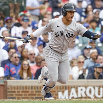 Sep 6, 2024; Chicago, Illinois, USA; New York Yankees outfielder Juan Soto (22) singles against the Chicago Cubs during the third inning at Wrigley Field. Mandatory Credit: Kamil Krzaczynski-Imagn Images