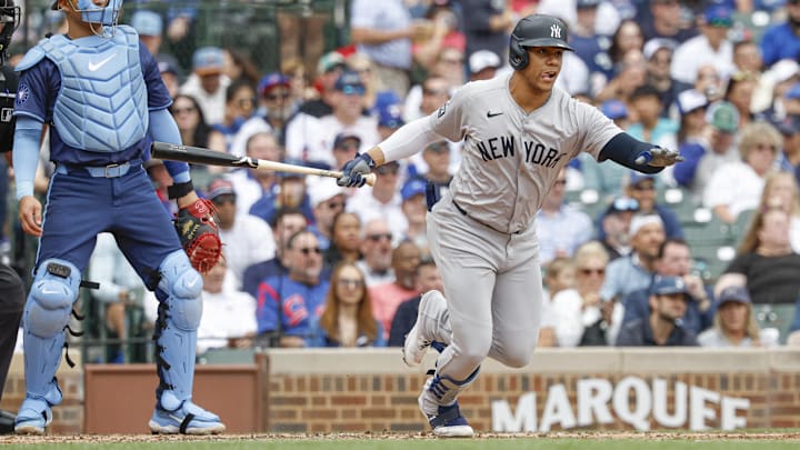 Sep 6, 2024; Chicago, Illinois, USA; New York Yankees outfielder Juan Soto (22) singles against the Chicago Cubs during the third inning at Wrigley Field. Mandatory Credit: Kamil Krzaczynski-Imagn Images