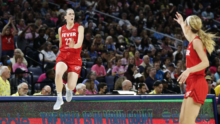 Clark celebrates after scoring against the Chicago Sky during the second half at Wintrust Arena.