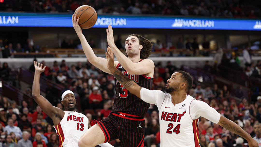 Nov 21, 2025; Chicago, Illinois, USA; Chicago Bulls guard Josh Giddey (3) drives to the basket against Miami Heat guard Norman Powell (24) during the first half at United Center. Mandatory Credit: Kamil Krzaczynski-Imagn Images Nov 21, 2025; Chicago, Illinois, USA; Chicago Bulls guard Josh Giddey (3) drives to the basket against Miami Heat guard Norman Powell (24) during the first half at United Center. Mandatory Credit: Kamil Krzaczynski-Imagn Images