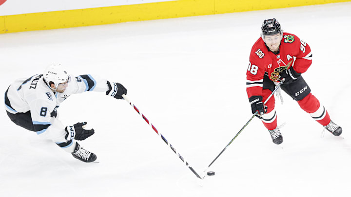 Mar 9, 2026; Chicago, Illinois, USA; Utah Mammoth center Nick Schmaltz (8) battles for the puck with Chicago Blackhawks center Connor Bedard (98) during the second period at United Center. Mandatory Credit: Kamil Krzaczynski-Imagn Images