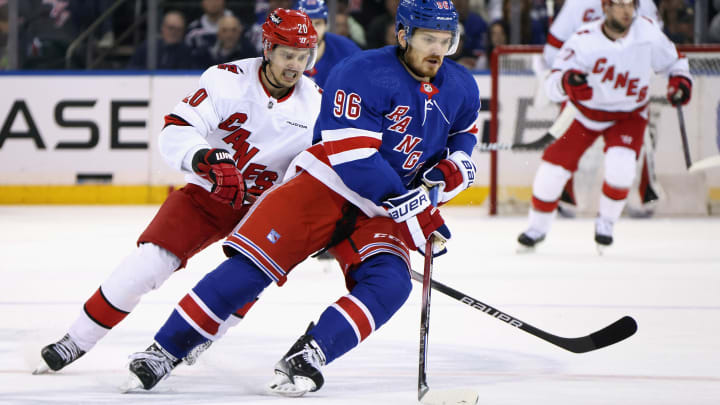 Jack Roslovic races for the puck against Sebastian Aho in the 2024 NHL playoffs.