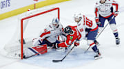Dec 17, 2024; Chicago, Illinois, USA; Chicago Blackhawks center Ryan Donato (8) scores a goal against Washington Capitals goaltender Logan Thompson (48) during the third period at United Center. Mandatory Credit: Kamil Krzaczynski-Imagn Images