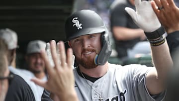 Chicago White Sox first baseman Tim Elko (30) celebrates with teammates after hitting a solo home run against the Chicago Cubs at Wrigley Field. 