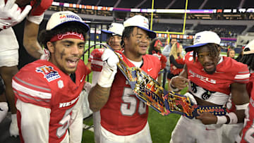 The UNLV Rebels celebrate after defeating the California Golden Bears in the LA Bowl at SoFi Stadium. 