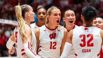 Natalie Wardlow celebrates with her teammates after a point. The Lincoln Southeast graduate recorded four aces for the Badgers against Nebraska. 