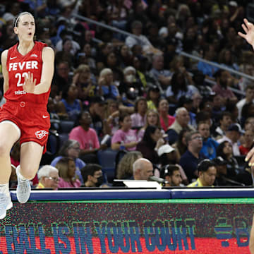 Aug 30, 2024; Chicago, Illinois, USA; Indiana Fever guard Caitlin Clark (22) celebrates after scoring against the Chicago Sky during the second half at Wintrust Arena. Mandatory Credit: Kamil Krzaczynski-Imagn Images