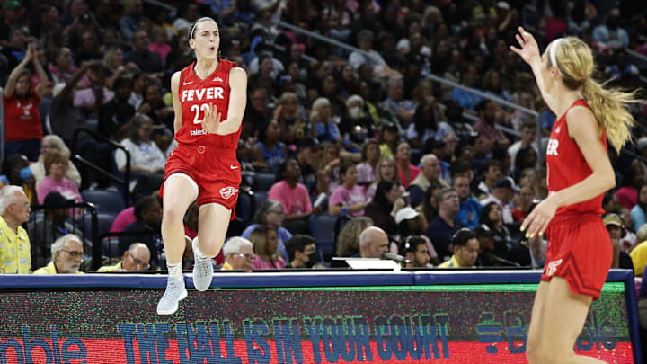 Aug 30, 2024; Chicago, Illinois, USA; Indiana Fever guard Caitlin Clark (22) celebrates after scoring against the Chicago Sky during the second half at Wintrust Arena. Mandatory Credit: Kamil Krzaczynski-Imagn Images