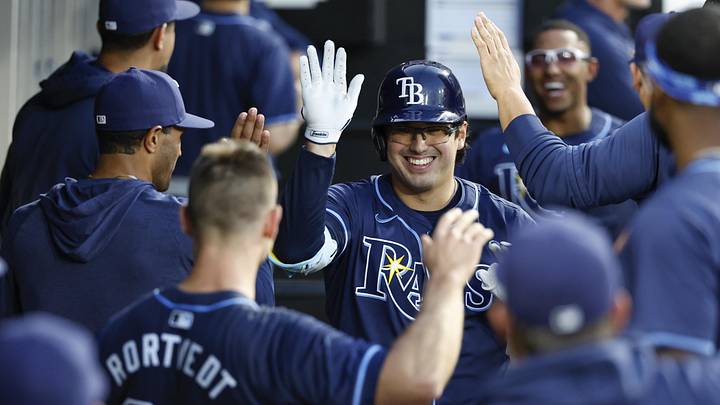 Apr 27, 2024; Chicago, Illinois, USA; Tampa Bay Rays first baseman Austin Shenton (54) celebrates with teammates after hitting a solo home run against the Chicago White Sox during the fifth inning at Guaranteed Rate Field. Mandatory Credit: Kamil Krzaczynski-Imagn Images