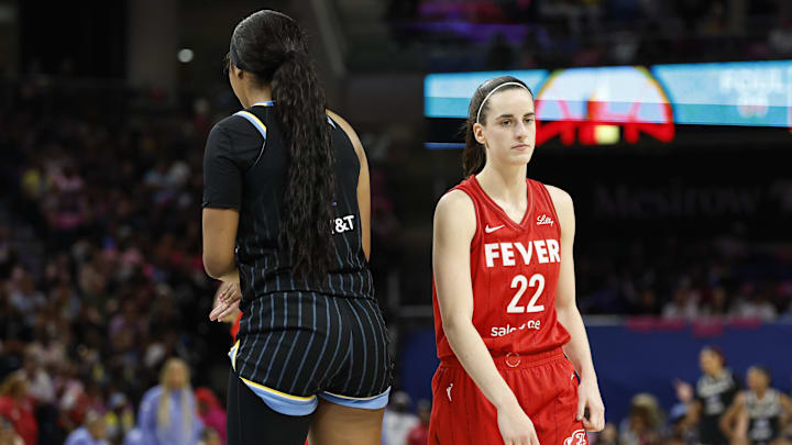 Aug 30, 2024; Chicago, Illinois, USA; Indiana Fever guard Caitlin Clark (22) walks by Chicago Sky forward Angel Reese (5) during the second half at Wintrust Arena. Mandatory Credit: Kamil Krzaczynski-Imagn Images