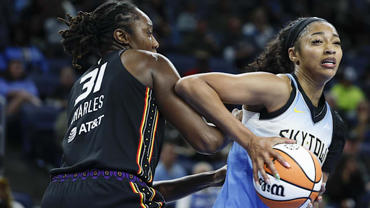 Sep 3, 2025; Chicago, Illinois, USA; Chicago Sky forward Angel Reese (5) drives to the basket against Connecticut Sun center Tina Charles (31) during the second half at Wintrust Arena. Mandatory Credit: Kamil Krzaczynski-Imagn Images