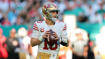 Dec 22, 2024; Miami Gardens, Florida, USA; San Francisco 49ers quarterback Brock Purdy (13) looks for a passing option against the Miami Dolphins during the first quarter at Hard Rock Stadium. Mandatory Credit: Sam Navarro-Imagn Images