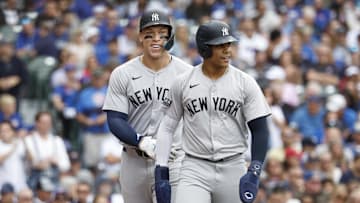 Sep 6, 2024; Chicago, Illinois, USA; New York Yankees outfielder Aaron Judge (99) and New York Yankees outfielder Juan Soto (22) celebrate after scoring agianst the Chicago Cubs during the third inning at Wrigley Field. Mandatory Credit: Kamil Krzaczynski-Imagn Images