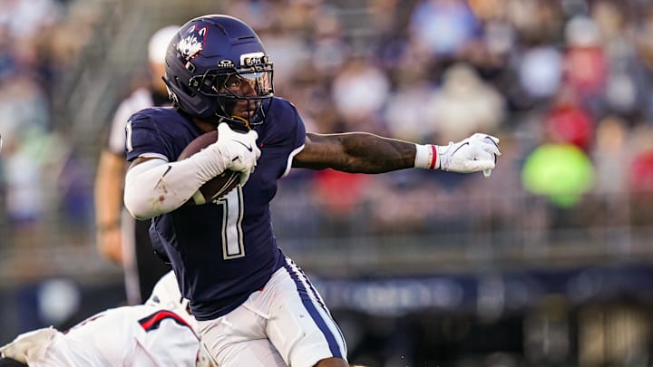 Sep 20, 2025; East Hartford, Connecticut, USA; Connecticut Huskies wide receiver Skyler Bell (1) runs the ball against et Ball State Cardinals in the second half at Pratt & Whitney Stadium at Rentschler Field. Mandatory Credit: David Butler II-Imagn Images