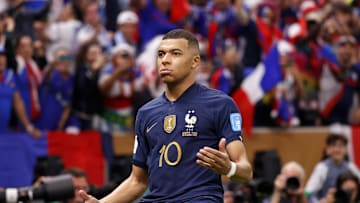 Dec 18, 2022; Lusail, Qatar; France forward Kylian Mbappe (10) celebrates after scoring a goal against Argentina on a penalty kick for his third goal of the match during extra time of the 2022 World Cup final at Lusail Stadium. Mandatory Credit: Yukihito Taguchi-Imagn Images