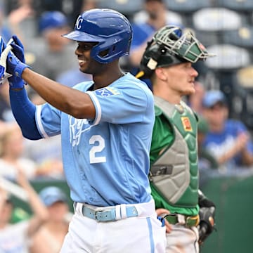 Jun 25, 2022; Kansas City, Missouri, USA;  Kansas City Royals center fielder Michael A. Taylor (2) celebrates with Kansas City Royals first baseman Carlos Santana (41) after hitting a three-run home during the eighth inning against the Oakland Athletics at Kauffman Stadium. Mandatory Credit: Peter Aiken-Imagn Images