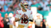 Dec 22, 2024; Miami Gardens, Florida, USA; San Francisco 49ers quarterback Brock Purdy (13) looks for a passing option against the Miami Dolphins during the first quarter at Hard Rock Stadium. Mandatory Credit: Sam Navarro-Imagn Images