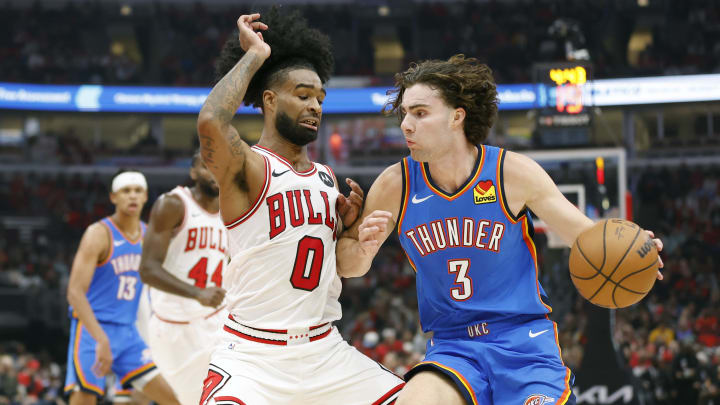 Oct 25, 2023; Chicago, Illinois, USA; Oklahoma City Thunder guard Josh Giddey (3) drives to the basket against Chicago Bulls guard Coby White (0) during the second half of a basketball game at United Center. Mandatory Credit: Kamil Krzaczynski-USA TODAY Sports