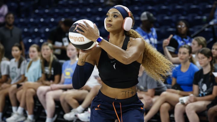 Jun 12, 2024; Chicago, Illinois, USA; Connecticut Sun guard DiJonai Carrington (21) warms up before a basketball game against the Chicago Sky at Wintrust Arena. 