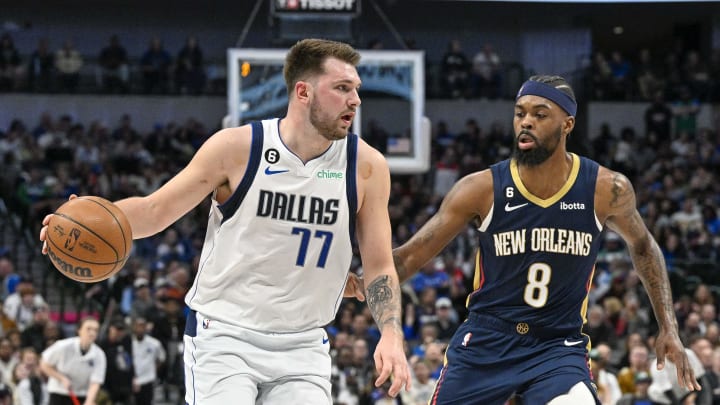 Jan 7, 2023; Dallas, Texas, USA; Dallas Mavericks guard Luka Doncic (77) and New Orleans Pelicans forward Naji Marshall (8) in action during the game between the Dallas Mavericks and the New Orleans Pelicans at the American Airlines Center. Mandatory Credit: Jerome Miron-USA TODAY Sports